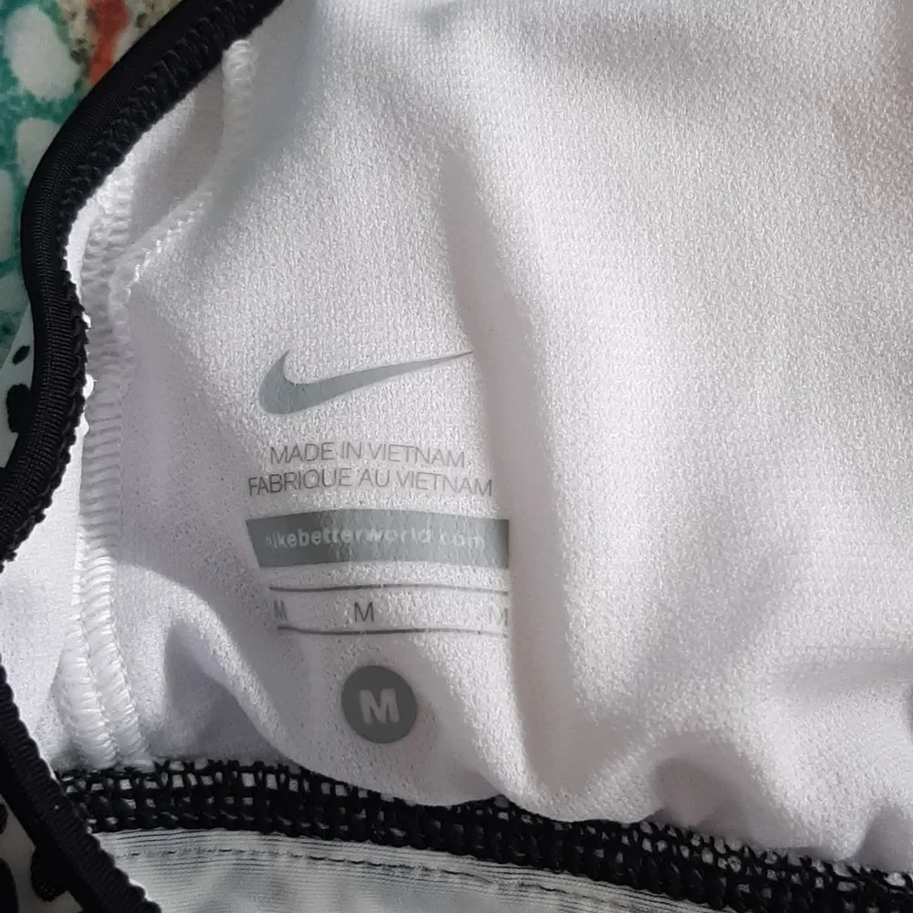Nike bathing suit top, black and white with aqua trim.